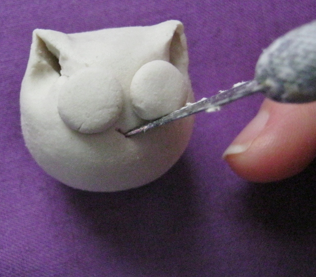 Голова кота из глины